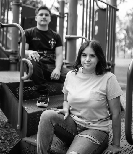 The Blessed and Redeemed team sitting on some steps at a playground, wearing their shirts